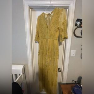 Womens yellow lace romper dress.